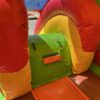 Château gonflable toboggan dinosaure avec marche